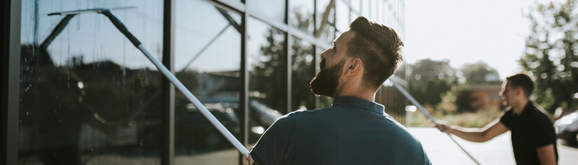 Window cleaners working together